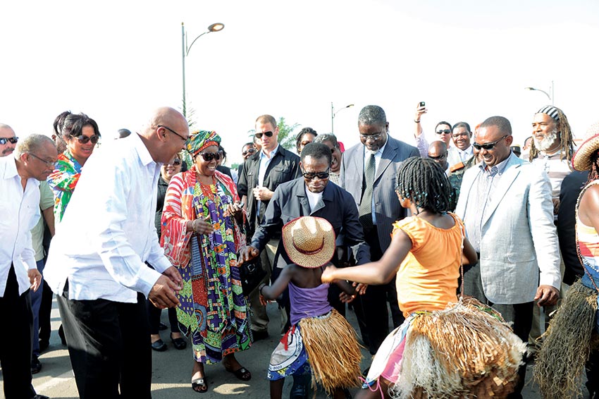 President Obiang, pictured here displaying some dancing skills with a pair of young traditional cultural performers, maintains good connections with ordinary citizens.