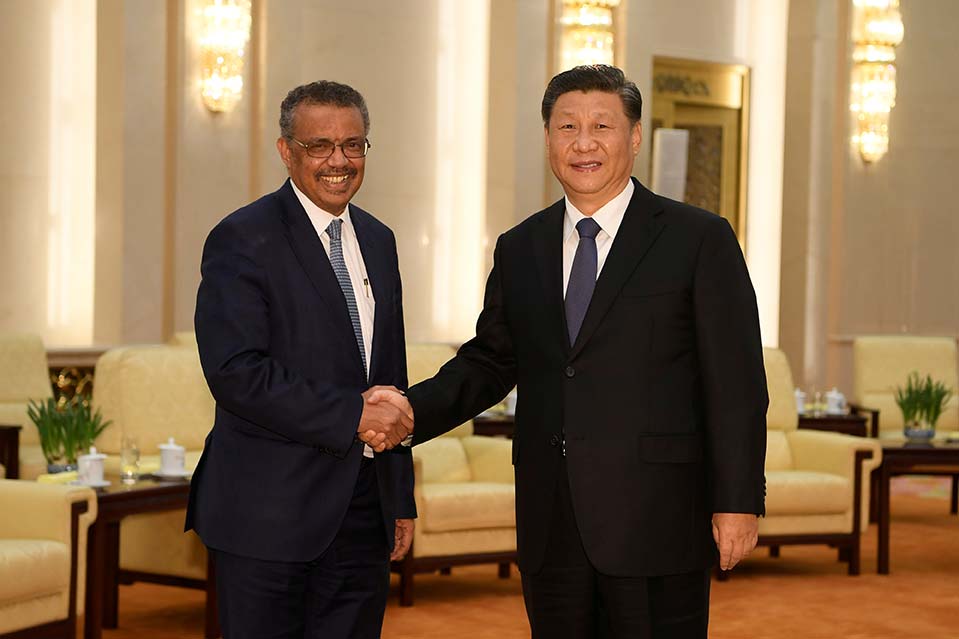 Tedros Ghebreyesus shakes hands with Chinese President Xi Jinping before a meeting at the Great Hall of the People in Beijing on January 28, 2020.
