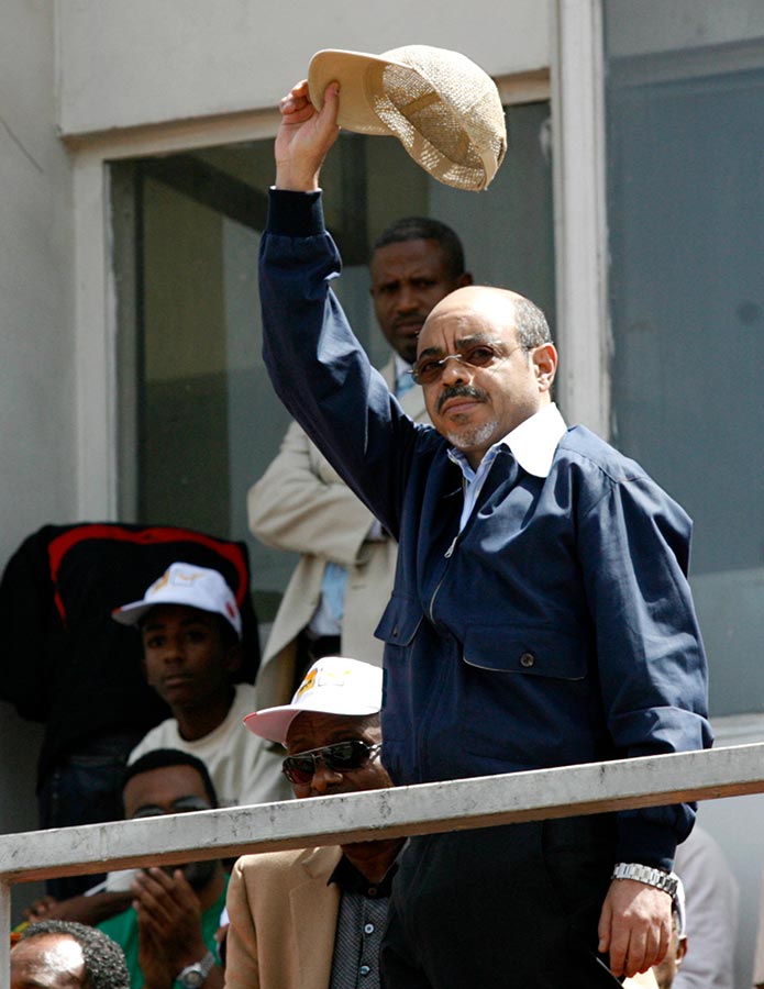 Former Prime Minister Meles Zenawi lifts his cap. He was the head of the Ethiopian People’s Revolutionary Democratic Front since its formation in 1991 until his death on August 20, 2012.