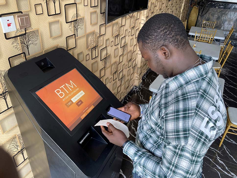 A user buys bitcoins with naira on a bitcoin teller machine in Lagos, Nigeria.