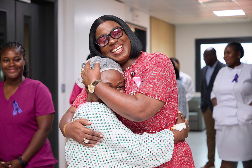 Adjoa Obuobia Darko-Opoku, administrator of the new Ghana Medical Trust Fund, gives a warm hug to a patient. The fund is President John Mahama’s initiative to provide treatment for chronic, non-communicable diseases. Darko-Opoku says she believes it will be “a significant game-changer.”