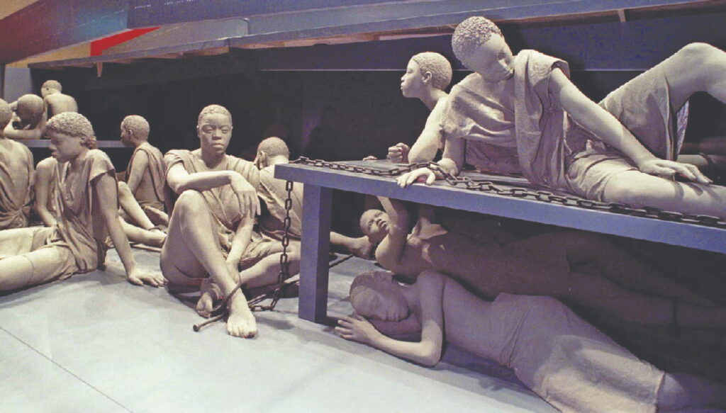 Life-size sculptures of enslaved Africans are part of a 70-foot replica of a slave ship featured in “And Still We Rise,” the core exhibit at the Detroit Museum of African American History, now known as The Wright. The slave ship is a silent commemoration of Africans who lost their lives crammed into slave ships on the transatlantic voyage known as the Middle Passage.