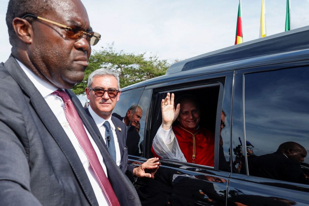 Leo waves after arriving in Yaounde.