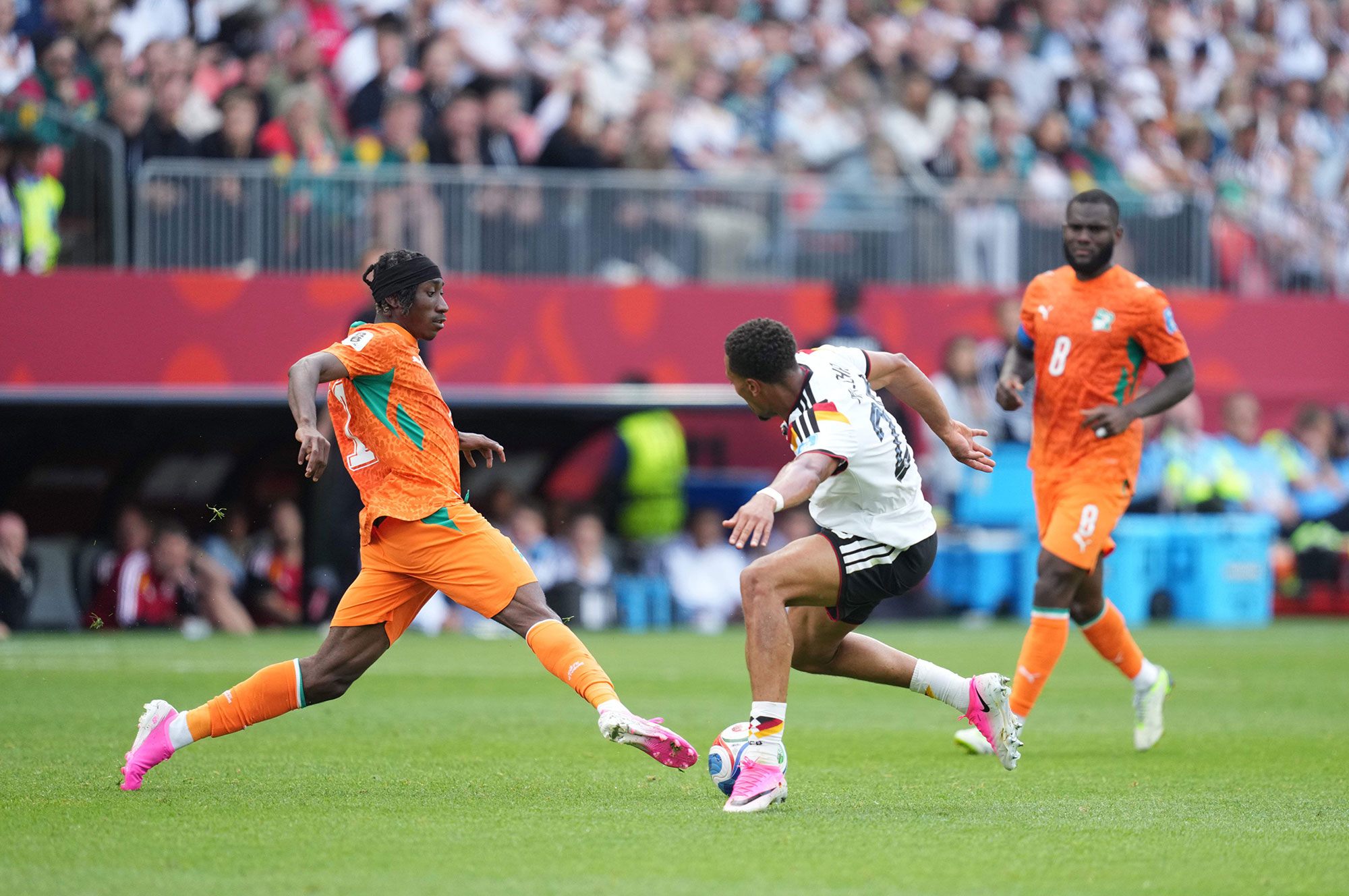 Cote d'Ivoire’s rising star Yan Diomande and German midfielder Felix Nmecha vie for the ball during their Group E match in Toronto, Canada June 20. Germany came from behind to win 2-1 on two late goals by substitute Deniz Undav.