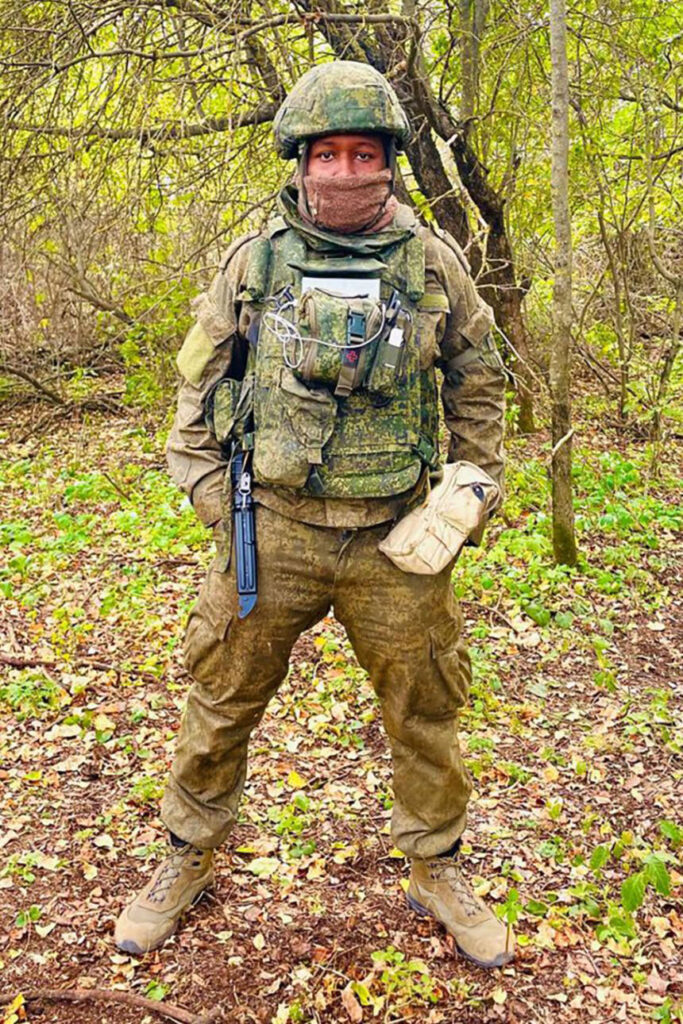 Kenyan Charles Njoki, pictured in a Russian military uniform in Ukraine, says a Ukrainian drone attack left him with a limp left hand and a spinal issue that will require surgery. He says Russian forces used African soldiers as bait for drone attacks.