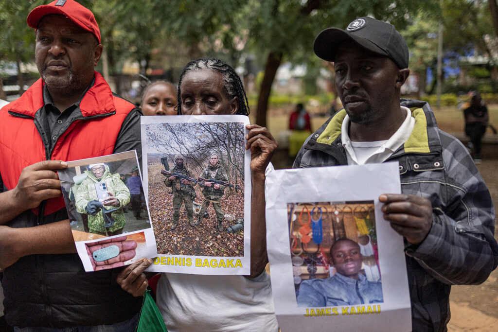 Relatives of Kenyans recruited by Russia pose with photos of their family members during a demonstration in Nairobi in February, demanding that the government take urgent action to bring their kin back from the war.