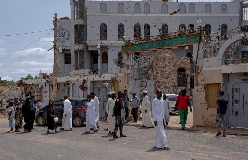 People gather in front of the Garib Ula Mosque in the Wad Nubawi neighborhood in eastern Omdurman for Friday prayers. Many people have returned to the neighborhood since the SAF retook control of the area in April 2024.