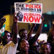 A demonstrator holds a sign during a protest over alleged police brutality in Lagos, Nigeria on October 17, 2020. A demonstrator holds a sign during a protest over alleged police brutality in Lagos, Nigeria on October 17, 2020.