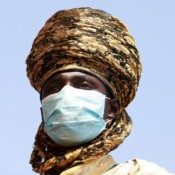 Emir of Jiwa's guard wears a face mask. Emir of Jiwa's guard wears a face mask.