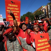 Members of South Africa's Economic Freedom Fighters party (EFF) demonstrate outside the French Embassy in Pretoria on Africa Day, demanding the end of France’s influence on the continent on May 25, 2022. Members of South Africa's Economic Freedom Fighters party (EFF) demonstrate outside the French Embassy in Pretoria on Africa Day, demanding the end of France’s influence on the continent on May 25, 2022.